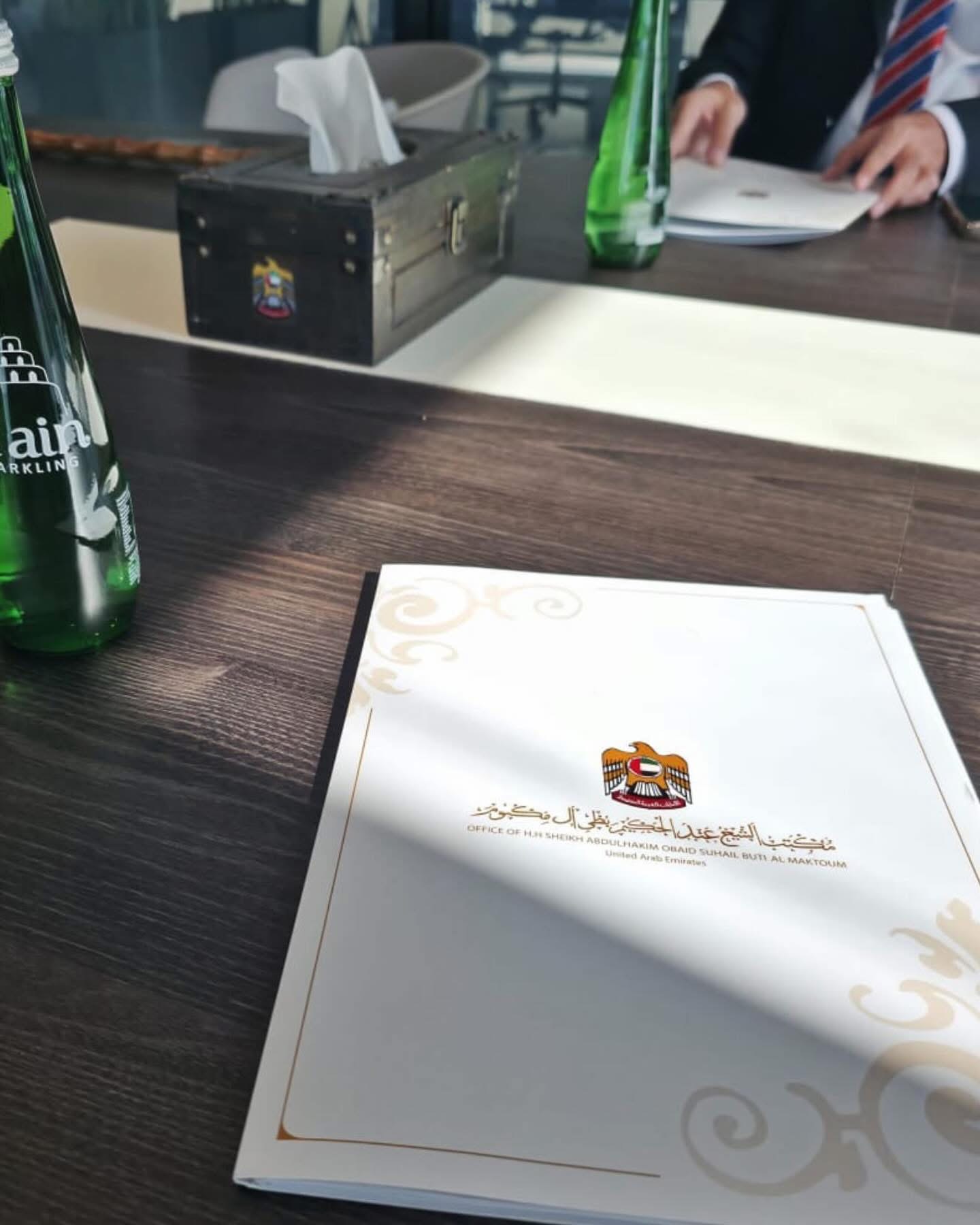 Meeting table and documents during a professional visit in the UAE.